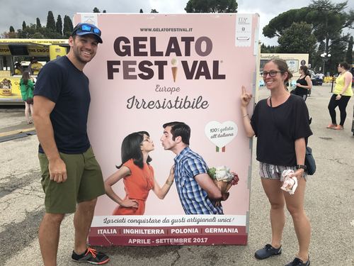 Chase and Allie beside a Gelato Festival poster